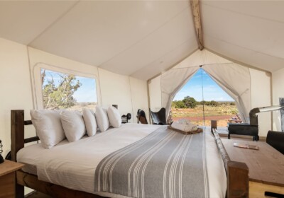 View of Bed in a Deluxe Tent at Under Canvas Grand Canyon