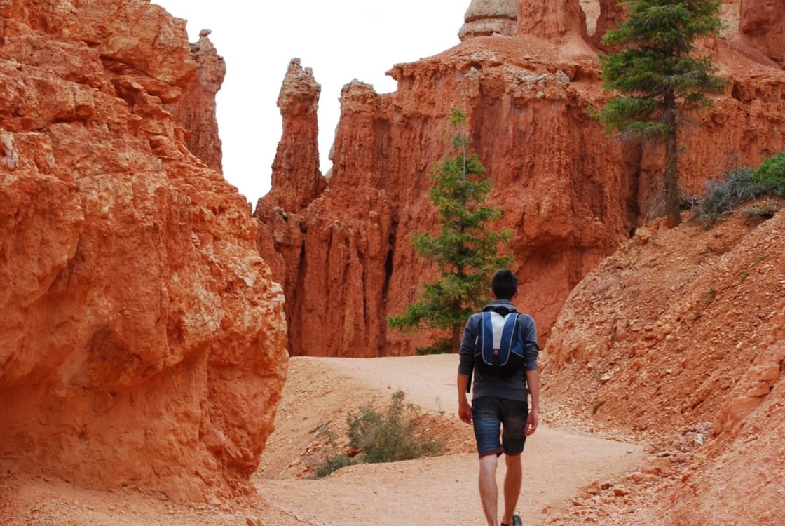 An Under Canvas guest hikes through Bryce Canyon.