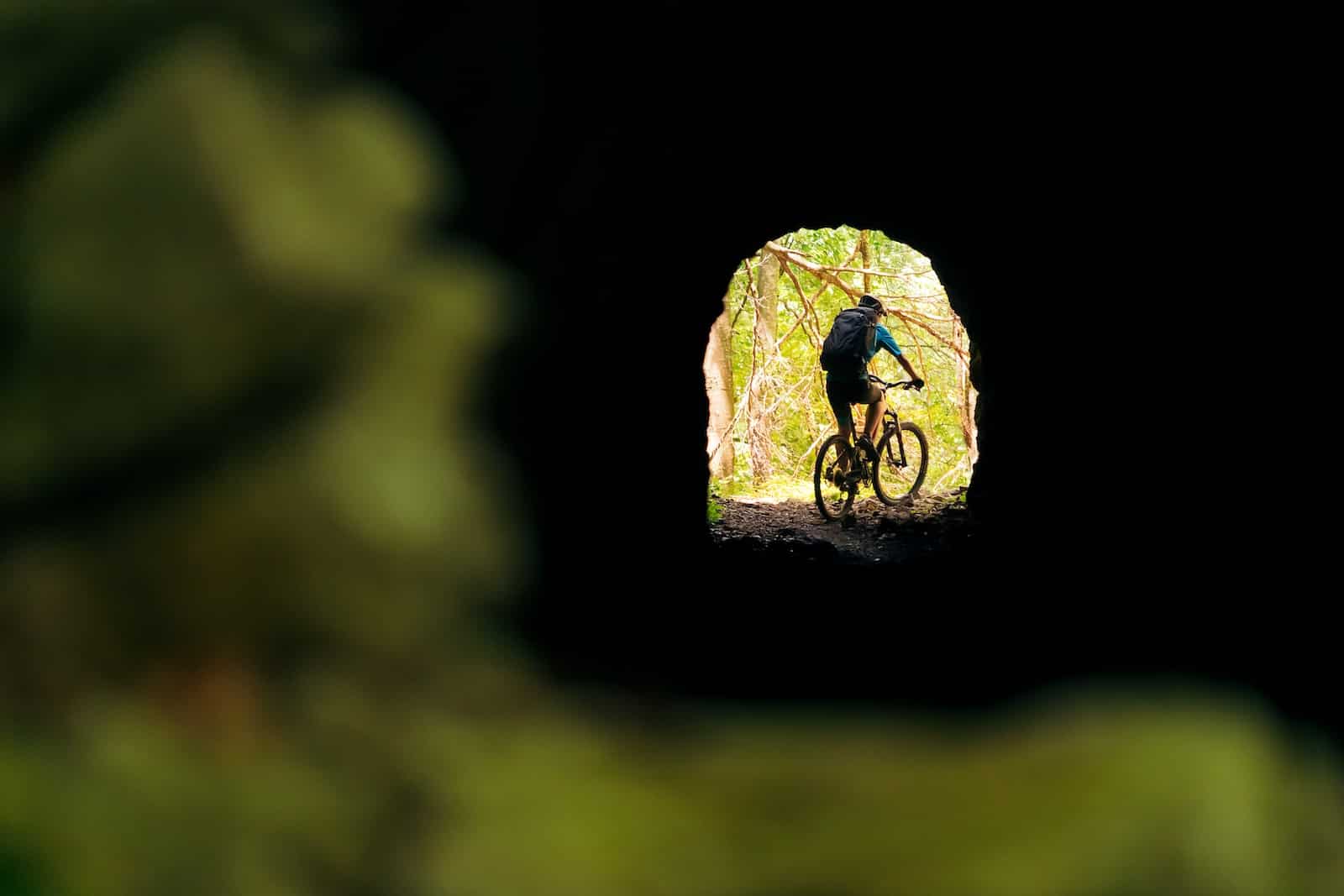 Mountain biker going through a tunnel in the Columbia River Gorge.