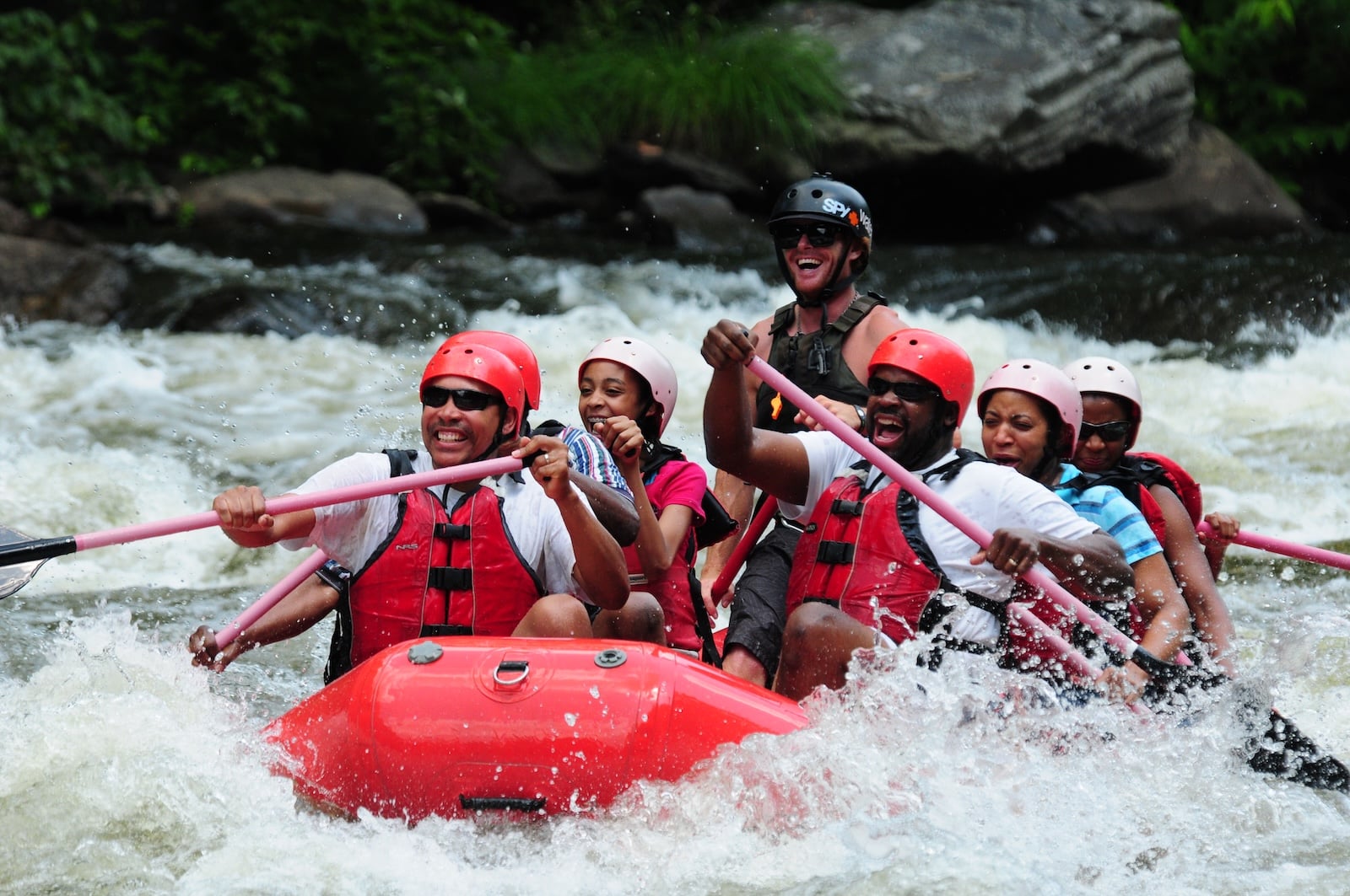 Family going through rapid on the Pigeon River.