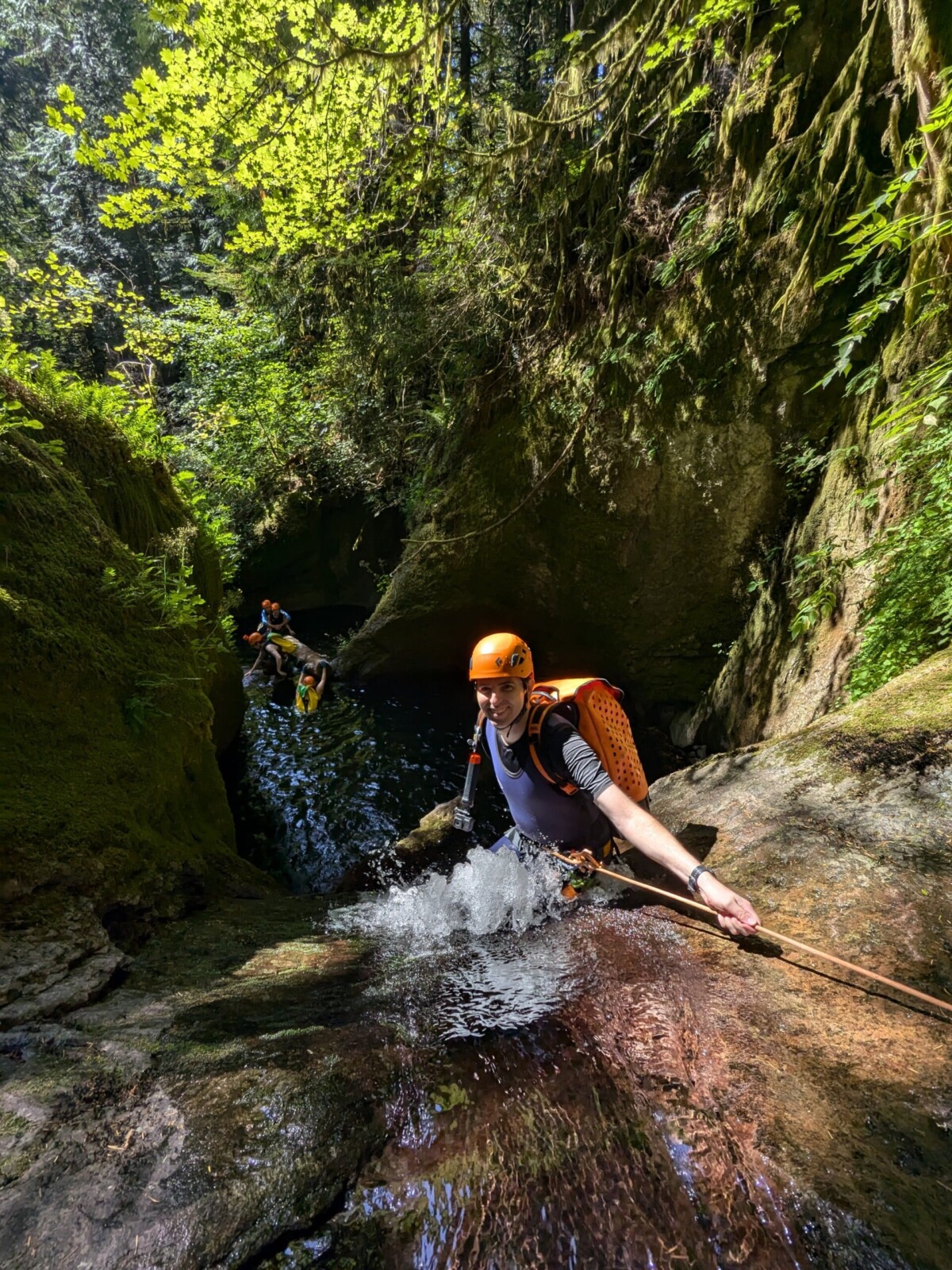 Guy getting ready to repel down a waterfall in the Columbia River Gorge.
