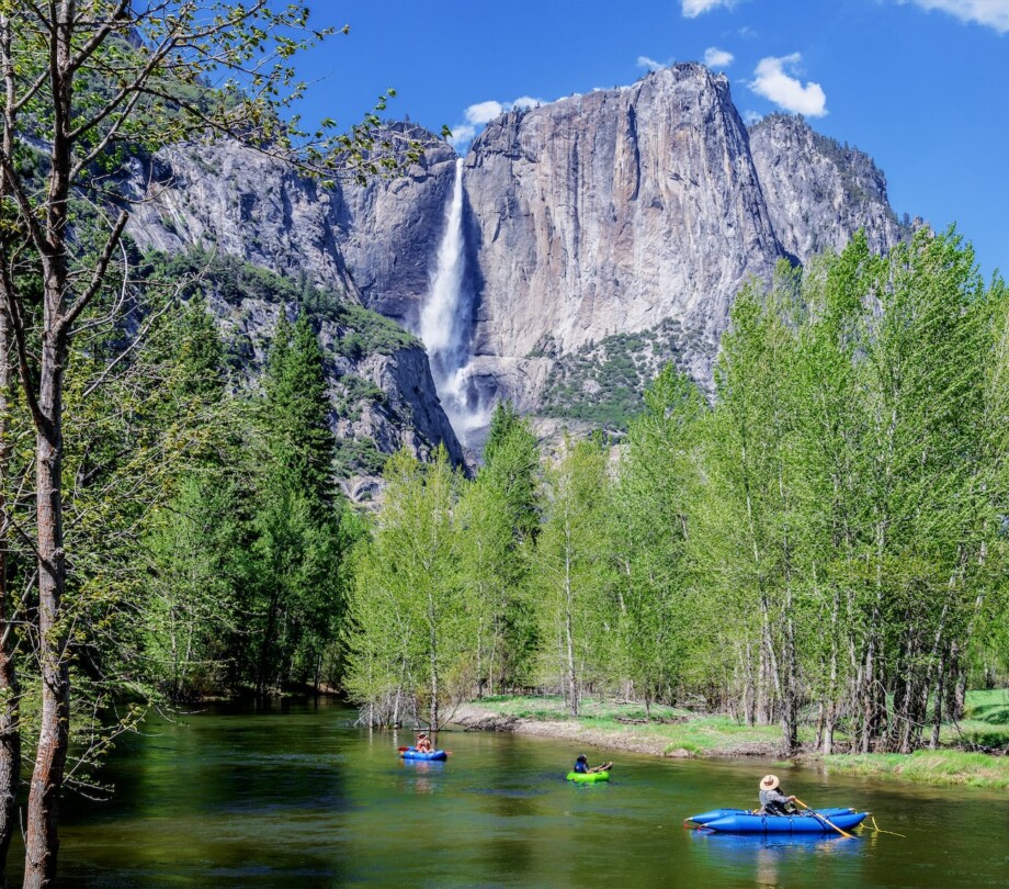 People kayaking in the river that runs through Yosemite valley.
